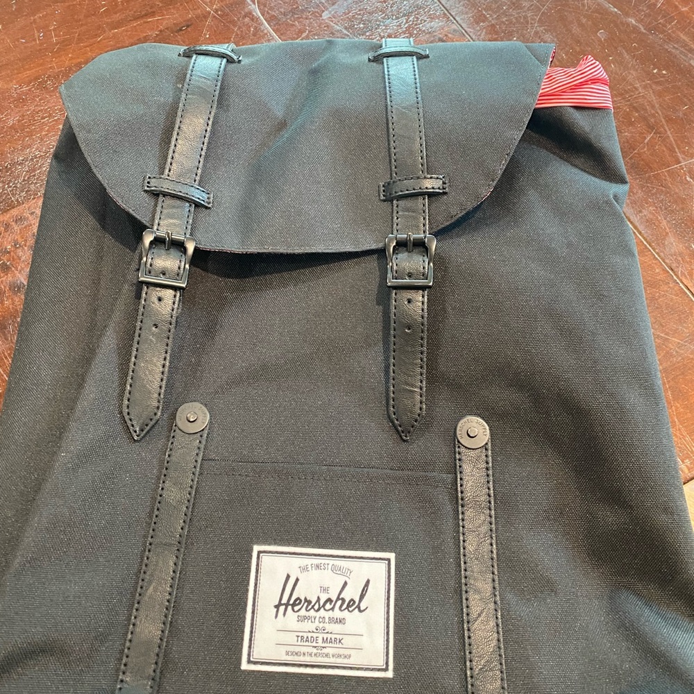 Black Hershel backpack with laptop spot.